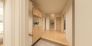 奥行きを感じさせる廊下が、住まいに広がりと落ち着きをもたらします（1号棟完成パース）
